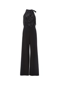 Czarny kombinezon z błyszczącą bezrękawnikową górą, wiązanym na szyi, oraz szerokimi nogawkami z gładkiego materiału, tworzy płynny kształt sylwetki.