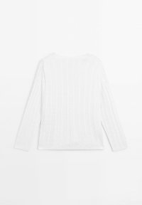 White knitted sweater with a cable pattern, featuring long sleeves and a rounded neckline. Soft texture and relaxed fit.