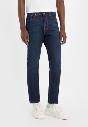 - Jeansy Slim Fit