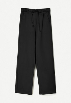 Pantaloni della tuta neri realizzati in materiale morbido, dotati di una vita elasticizzata con cordino, tasche laterali e design a gamba dritta.