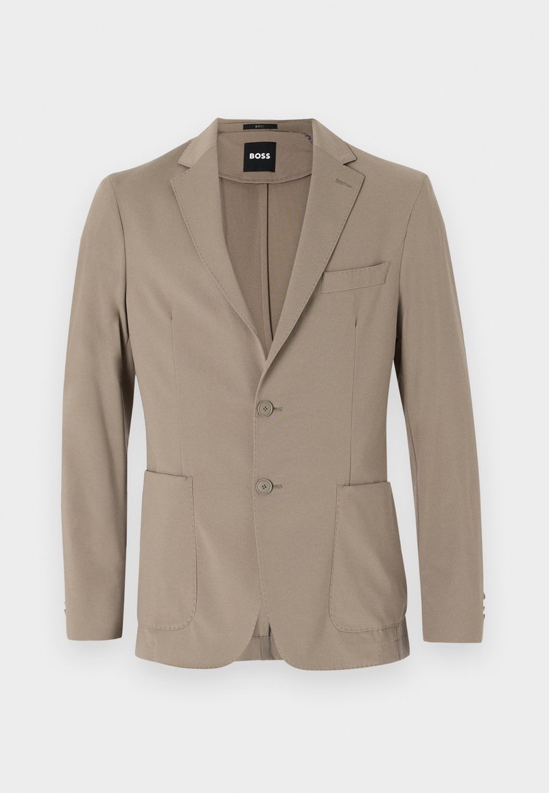 Blazer ajusté beige en tissu doux. Doté d'un design à un bouton avec deux boutons, revers crantés et deux poches avant.