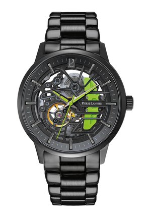 Montre squelette noire avec des accents métalliques, présentant des détails verts, un bracelet en acier inoxydable et un mécanisme de mouvement visible.