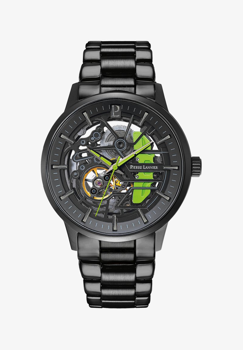 Orologio scheletrico nero con accenti metallici, caratterizzato da dettagli verdi, bracciale in acciaio inox e meccanismo di movimento visibile.