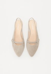 Beige suede slingback shoes with pointed toes, featuring a small buckle accent on the strap and an open heel design.