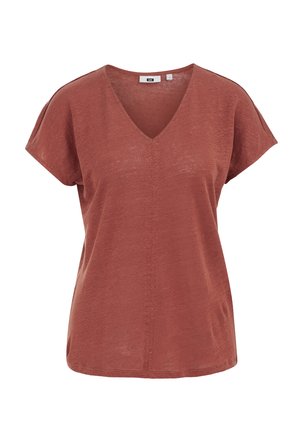 Ceglaste, krótki rękaw, damska bluzka z dekoltem w serek, o luźnym kroju z subtelnym pionowym przeszyciem po środku przodu.