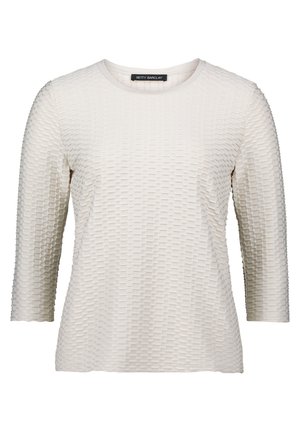 Maglietta a maniche lunghe di colore beige chiaro con un motivo testurizzato a piccoli quadrati, scollatura rotonda e un tessuto morbido e liscio.
