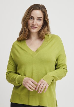V-hals, langærmet sweater i lys grøn, lavet af blødt strikmateriale med ribbede manchetter og kant, der har en afslappet pasform og sideslids.