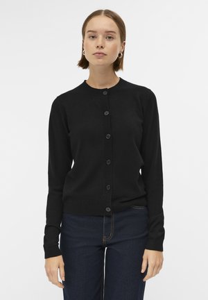 Cardigan noir en tissu doux, doté d'un col rond, d'une fermeture à boutons à l'avant et de manches longues. Design simple avec une silhouette ajustée.