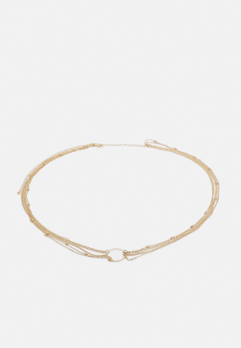 Gold multi-strand necklace featuring layered chains of varying thickness, with a central round connector and small decorative beads.