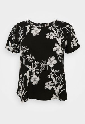 Blusa negra de manga corta con estampado floral tropical blanco y escote redondo, exhibida sobre fondo blanco liso.