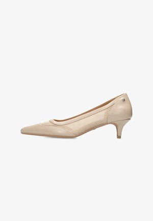 Beige low-heel pump with a pointed toe, featuring a mesh side panel and smooth leather upper, complemented by a small metallic accent.