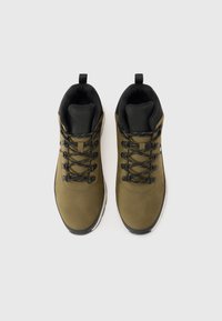 Olive green hiking shoes with a smooth upper, black accents, lace-up design, and a cushioned collar and tongue for comfort.