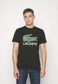 Lacoste Nyomott mintás póló - noir
