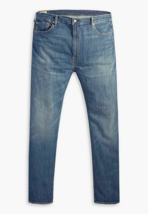 Jeans en denim bleu clair avec une coupe droite, cinq poches, couture contrastée et fermeture à glissière à l'avant.