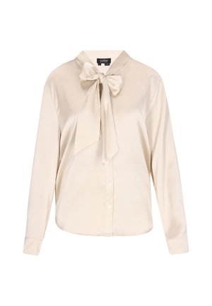 Beige satin blouse with long sleeves, a collar, and a large bow tie detail at the neck. Features button closures along the front.