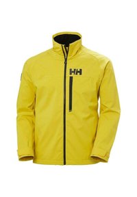 Giacca impermeabile gialla con accenti neri, colletto alto, zip frontale e tasca sul petto. Tessuto liscio e vestibilità tailored.