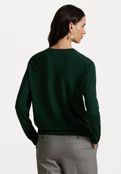 Dark green knit sweater with a classic crew neckline, ribbed cuffs, and hem. Features a smooth texture and lightweight design.