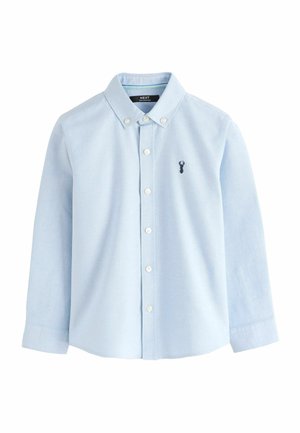 Light blue button-up shirt with collar and long sleeves, featuring a small dark deer logo on the left chest.