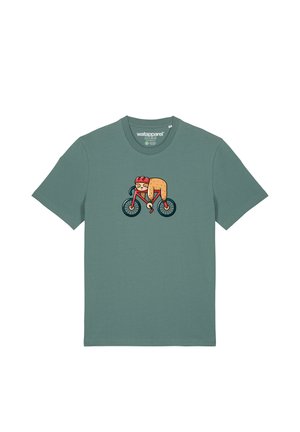 T-shirt en coton vert menthe avec un graphisme d'un personnage de dessin animé montant à bicyclette, portant un casque rouge distinctif et des détails texturés.