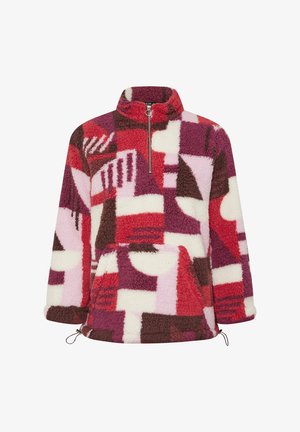 Polarowy pullover w czerwone, różowe i brązowe abstrakcyjne wzory. Wysoki kołnierz z pół-zipem, kieszenie boczne i ściągacz u dołu. Miękka faktura.