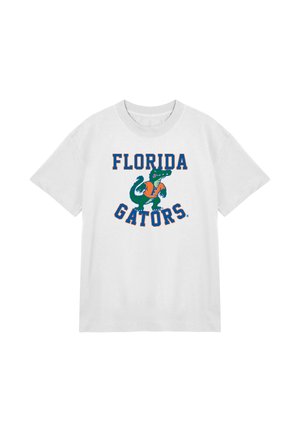 Biała bawełniana koszulka z grafiką zielonego aligatora i napisem "FLORIDA GATORS" w pomarańczowym i niebieskim kolorze. Okrągły dekolt i krótkie rękawy.