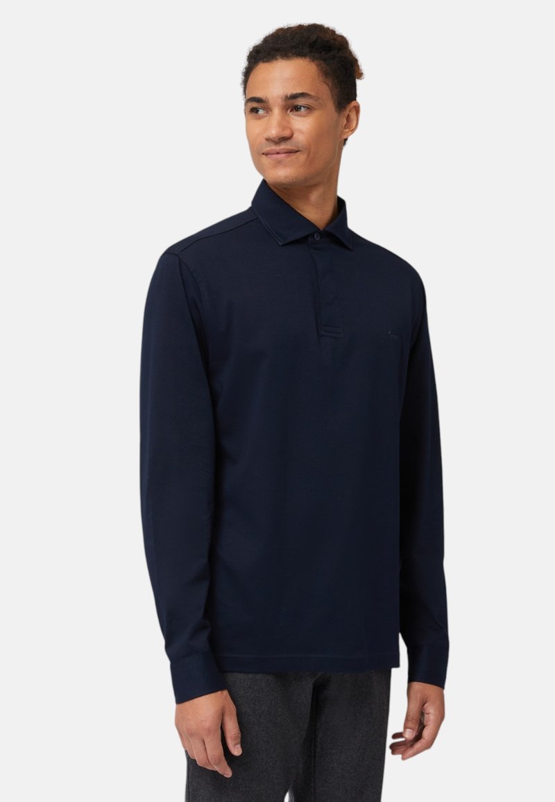 Polo a maniche lunghe blu navy con colletto, dotato di patta con due bottoni e vestibilità slim. Realizzato in tessuto morbido e traspirante.