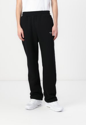 PETRO UNISEX - Tracksuit bottoms - black