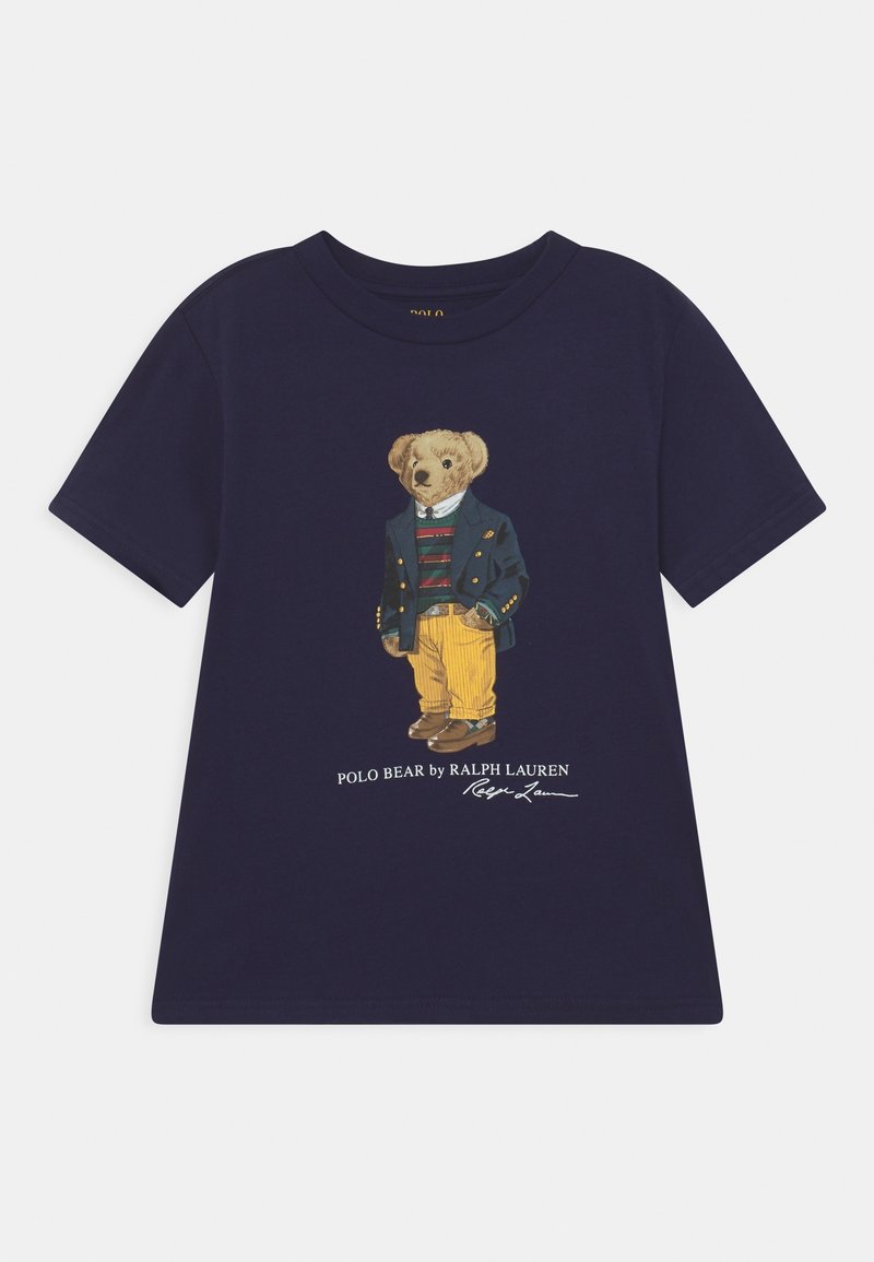 Navy blue t-shirt with a graphic of a bear wearing a green jacket, striped sweater, yellow pants, and brown shoes, with Polo Bear text below.