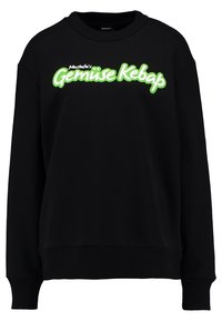 Black sweatshirt with long sleeves, ribbed cuffs, and hem. Features a bold green graphic text reading "Mustafa's Gemüse Kebap."