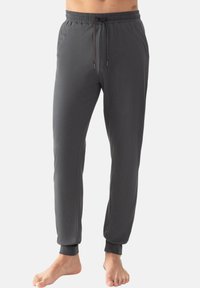 Grijze, lichte joggers met een elastische tailleband, verstelbare trekkoord en taps toelopende boorden. Glad textuur en minimalistisch ontwerp.
