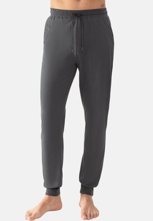 Pantalons de jogging gris, légers, avec une taille élastique, un cordon de serrage ajustable et des poignets fuselés. Texture lisse et design minimaliste.