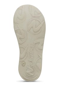 Semelle intérieure de chaussure beige clair avec une surface texturée, présentant un motif de logo circulaire répétitif et une inscription plus grande "NATURINO" en bas.