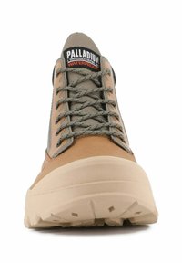 Waterproof hiking shoe in tan and grey, featuring a textured upper, reinforced toe cap, and deep tread outsole for grip.