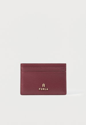 Burgundy textured leather cardholder with three card slots and gold Furla logo centered on the front.