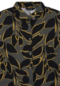 Camicia con bottoni in tessuto grigio con un grande motivo floreale nero e senape. Include un colletto e cinque bottoni frontali.