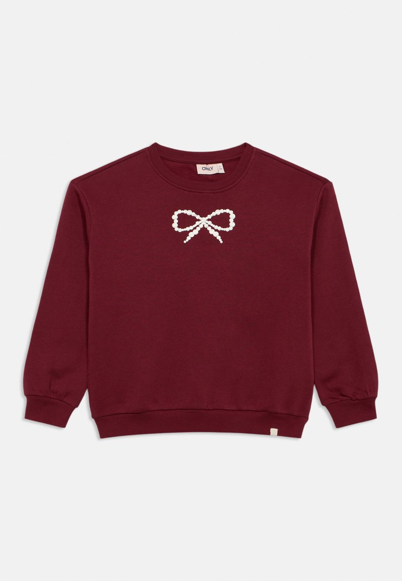 Burgundy tröja i mjukt tyg, med en vit pärlknut-design vid bröstet, samt ribbade ärmslut och fåll.
