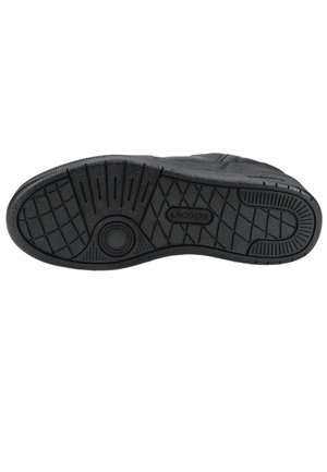 Semelle de chaussure noire avec motifs antidérapants texturés et le nom de la marque Lacoste embossé au centre.