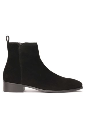 Black suede ankle boots with a smooth texture, rounded toe, and a low stacked heel. Features a side zipper and a pull tab at the back.