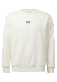 Sudadera blanca de cuello redondo con mangas largas y pequeño logo negro de Reebok centrado en el pecho.