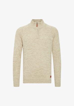 Beidzēs puszips džemperis ar teksturētu adījumu, raglānu piedurknēm un mazu oranžu logo birku kreisajā apakšējā malā.