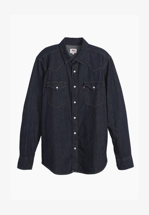 Dark denim long-sleeve shirt with pointed collar, two chest pockets, white buttons, and contrasting yellow stitching. Smooth, sturdy fabric.