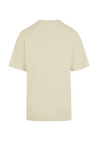 Cream-colored short-sleeve t-shirt with a round neckline, featuring a smooth texture and an overall relaxed fit. No visible graphics or accents.