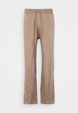 Light brown, wide-leg pants made of smooth fabric, featuring an elastic waistband with a drawstring and two front crease lines.