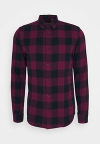 Chemise à manches longues, à boutons, présentant un motif à carreaux bordeaux et noir. Fabriquée en tissu doux avec un col classique et des poignets.