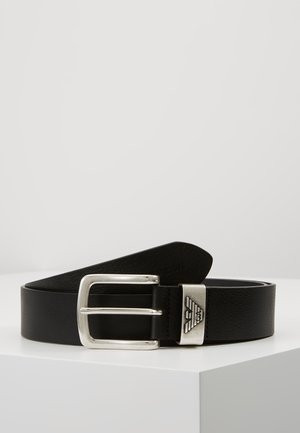 Black leather belt with a silver metal buckle. Features a textured finish and a logo accent on the buckle. Simple, classic design.