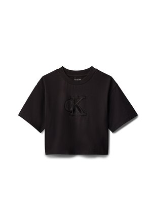 T-shirt nera corta realizzata in cotone. Presenta maniche corte e un logo "CK" goffrato in rilievo sul davanti. Tessuto dalla texture liscia.