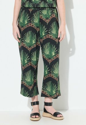 Schwarze, weite Hosen mit einem grünen Palmblattmuster. Hergestellt aus einem weichen Material, mit elastischem Bund und lässigem Schnitt.