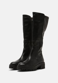 Schwarze kniehohe Stiefel aus glattem Leder, mit einem seitlichen Reißverschluss, einer stabilen strukturierten Sohle und einem runden Zehendesign.