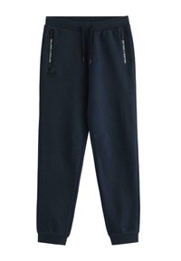 Navy sweatpants lavet af bomuldsblanding, med elastisk talje, lynlås lommer og diskret logo detaljer foran.
