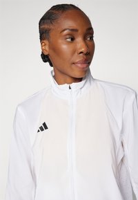 adidas Performance ADIZERO ESSENTIALS - Løbejakker - white